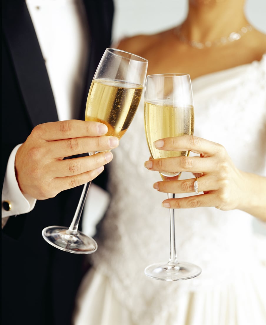 Bride and groom toasting with champagne